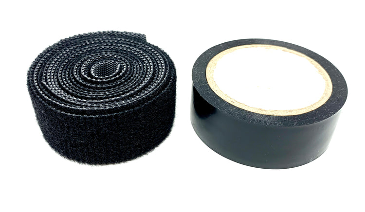 A roll of hook and loop material on a white background. Next to it is a roll of electrical tape.