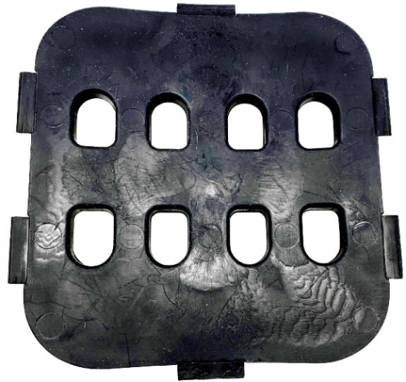 Thick rubber insert for a horse grazing muzzle. Squarish in shape, it has four small holes to restrict grass intake.