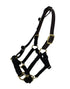 A nylon halter for a mini horse hanging in mid-air. It has a leather crownpiece.