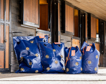 Hay bags and hay nets for horses for slow feeding hay