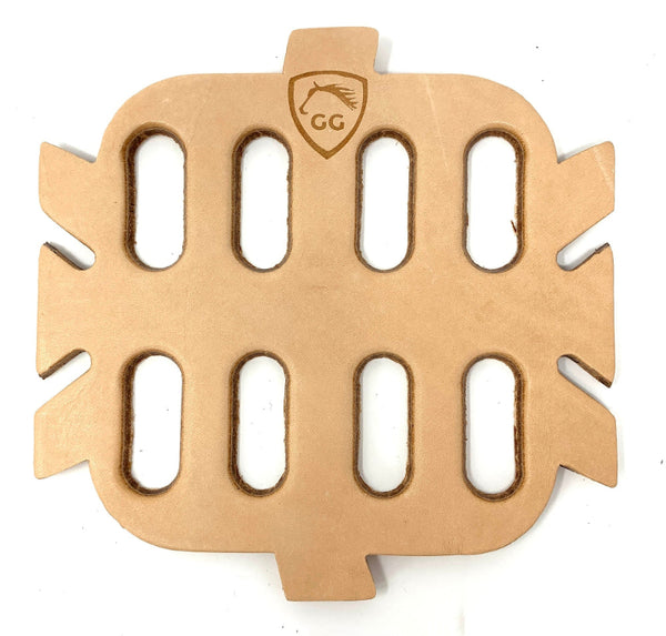 A leather grazing muzzle insert for ahorse sized GreenGuard Grazing Muzzle. It has one tab each at bottom and top, and three on each side. There are 8 slots in the insert, matching the interior slots of the muzzle.